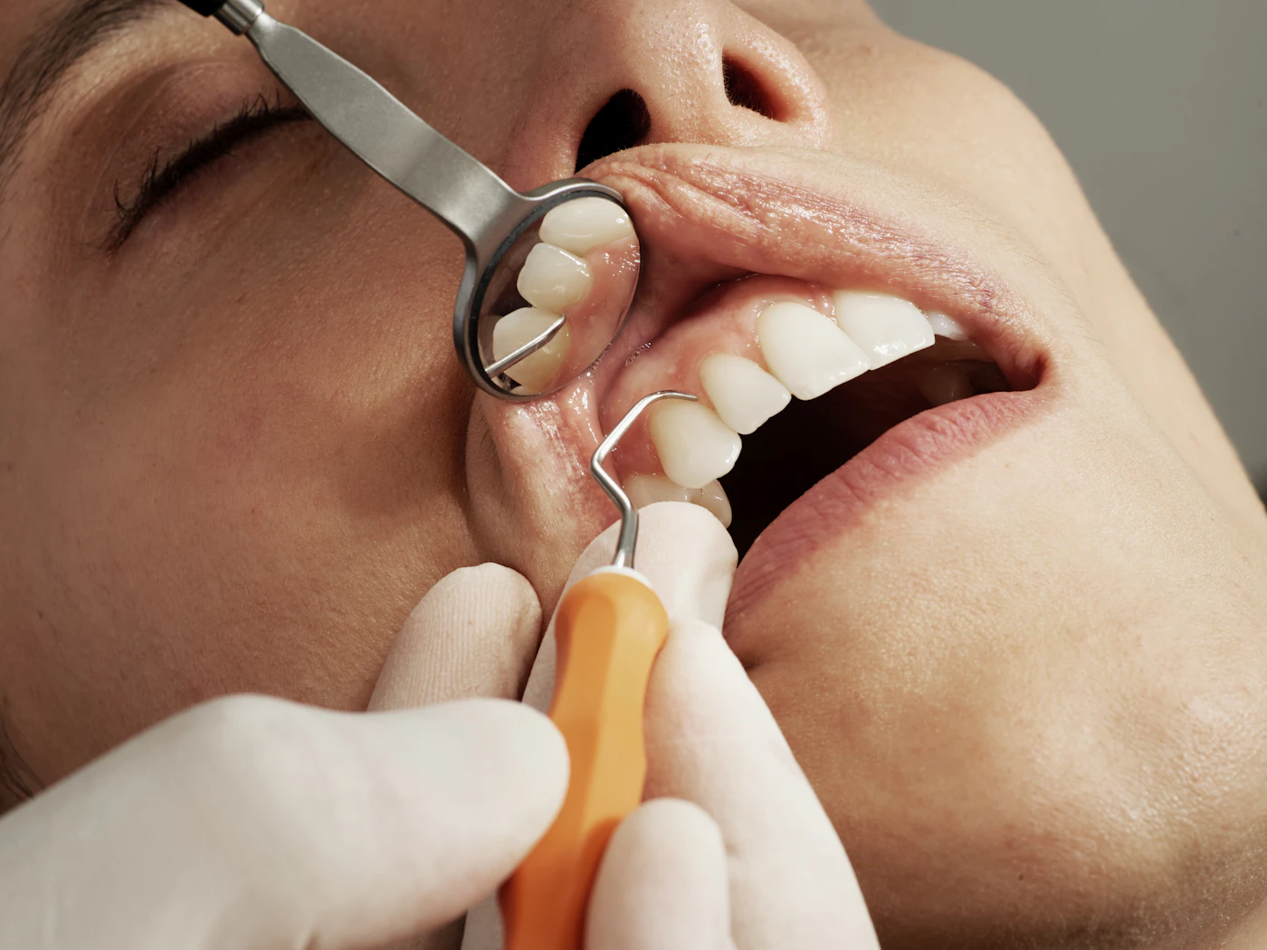 Dentist examining a patient in a modern Charlotte dental clinic